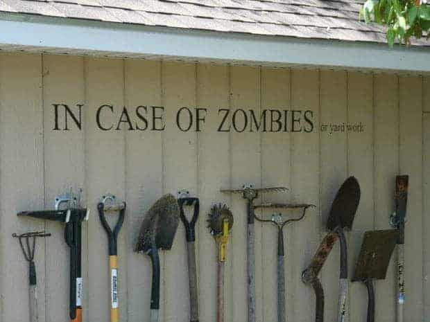 garden tool storage on wall with text reading "in case of zombies or yard work"
