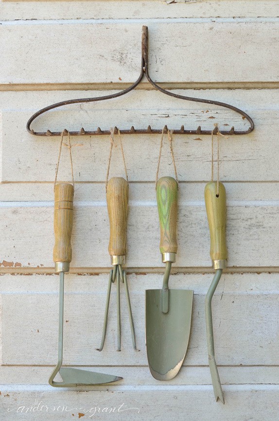 rake used as garden tool storage