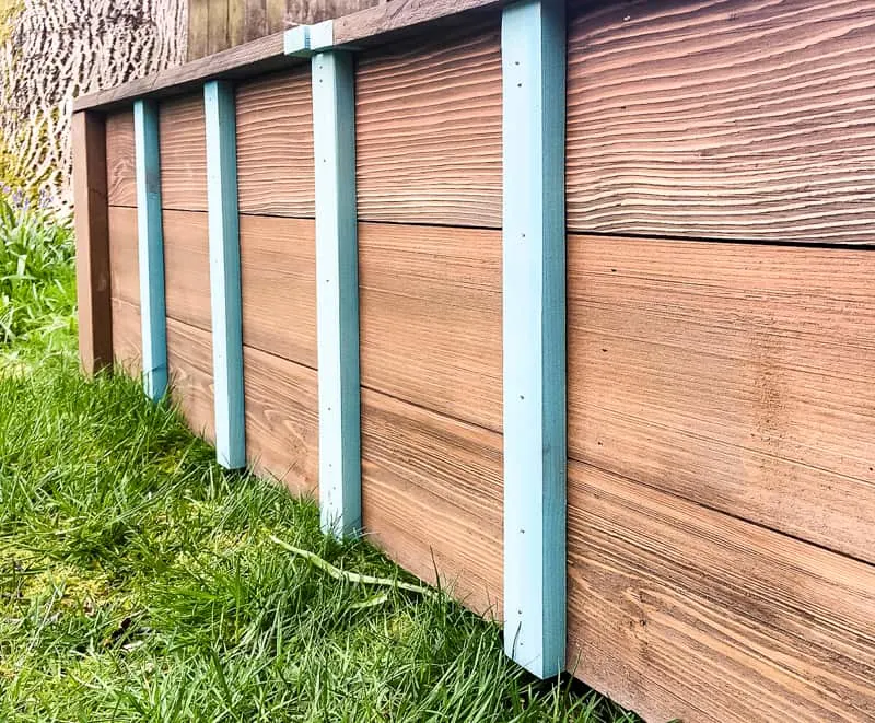 decorative slats on the front of the outdoor storage bench