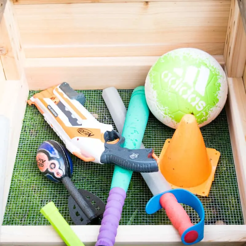 toys inside outdoor storage bench