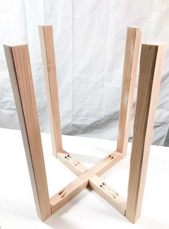 X shaped side table base with legs attached