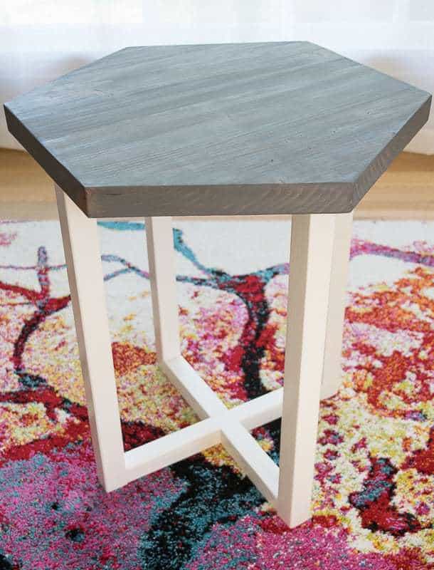 DIY hexagon side table on colorful carpet