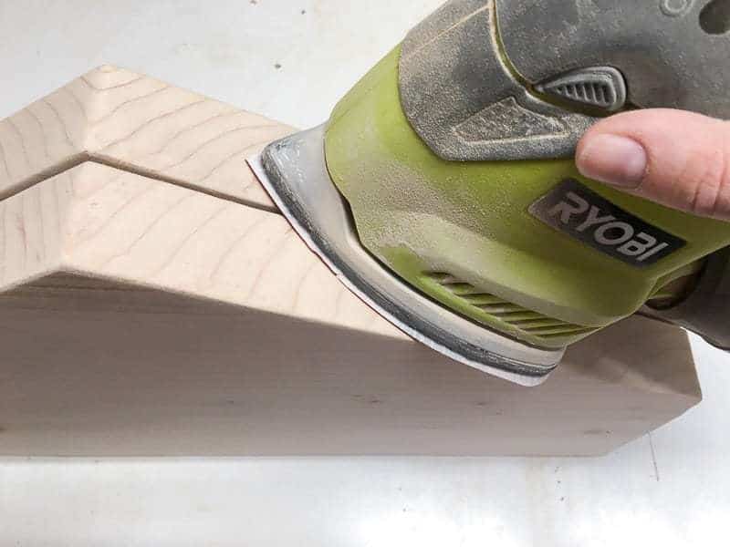 sanding edges of hexagon boards with a sander