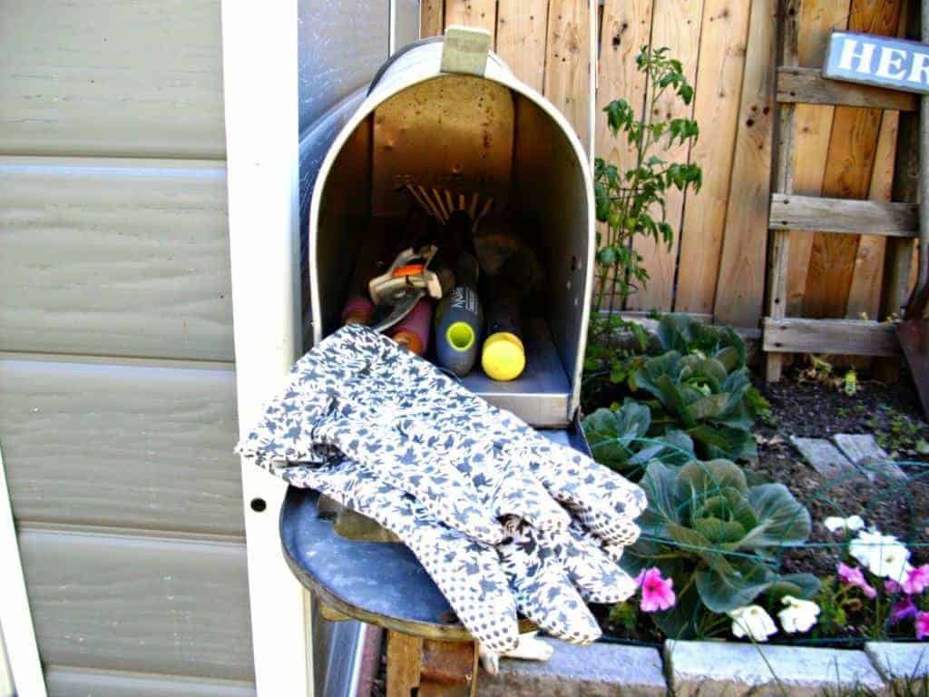 mailbox used as garden tool storage