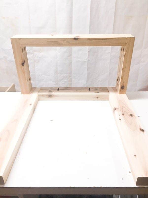 Assemble the planter side of the DIY end table the same way, but without one set of legs.