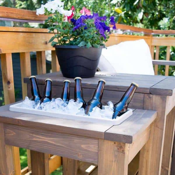 DIY outdoor end table with ice bucket full of beer bottles
