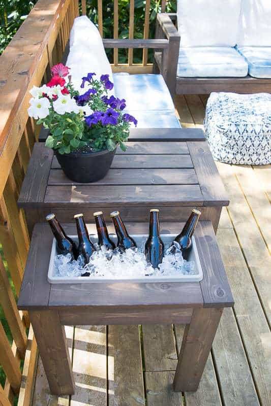 outdoor end table with ice bucket next to outdoor sofa