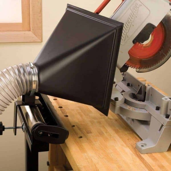 dust hood on roller stand behind a miter saw
