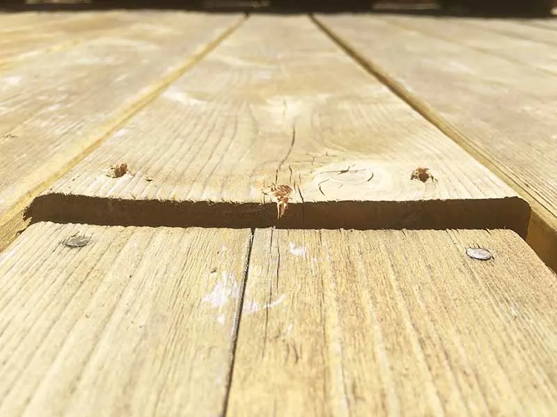 warped boards before deck repair