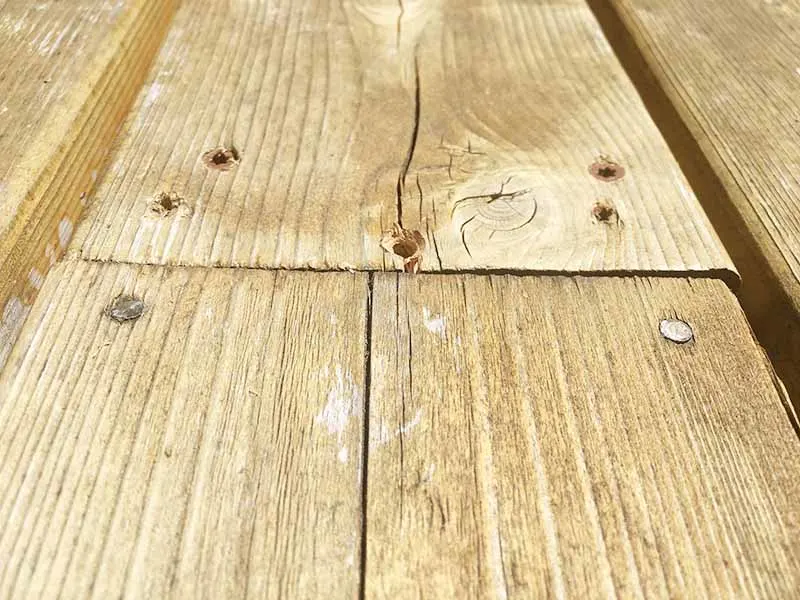 warped board straightened out by deck repair