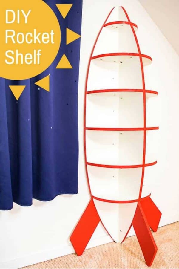 This rocket bookshelf is perfect for a space themed bedroom! Easy to make with just one sheet of plywood. Get the free woodworking plans and tutorial at The Handyman's Daughter! | rocket shelves | spaceship shelves | spaceship bookshelf | kids room idea | space theme | kids themed room | outer space kids room