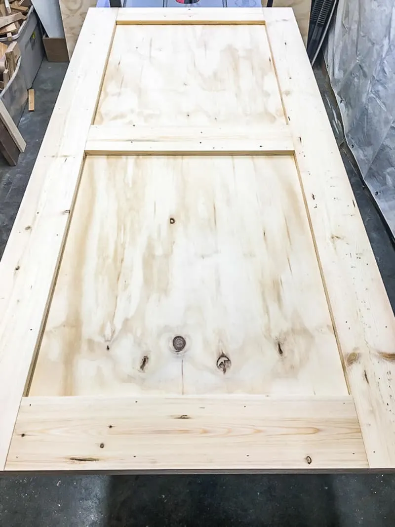 DIY barn door with plywood backing and 1x6 frame