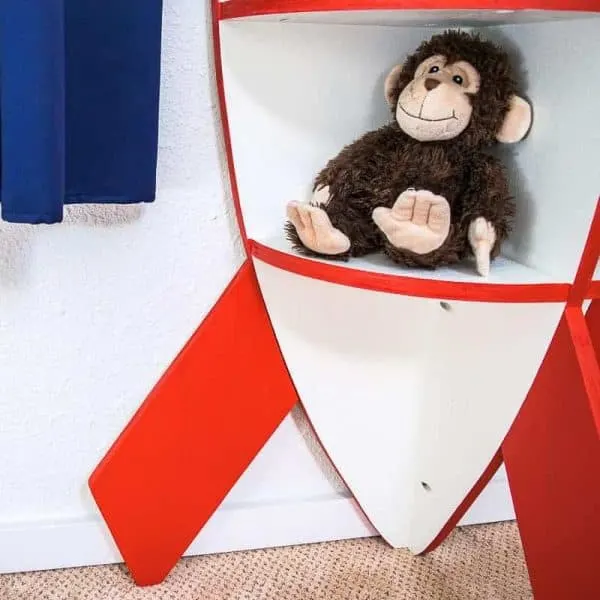 We have a monkey stowaway on our rocket bookshelf!