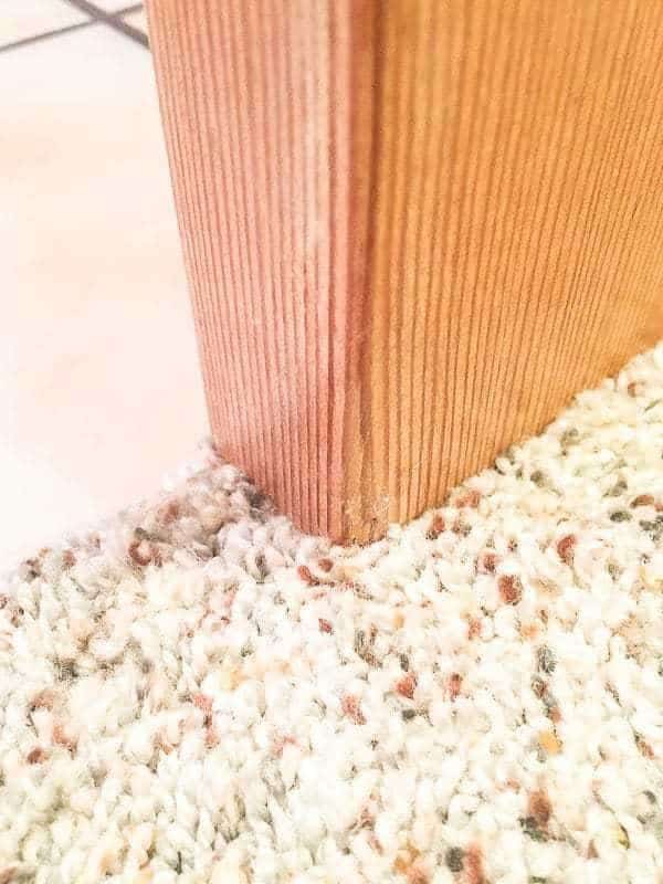 When we installed carpet over the tile, the pocket door became difficult to close.
