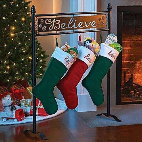 stocking rack with "Believe" cut out of metal