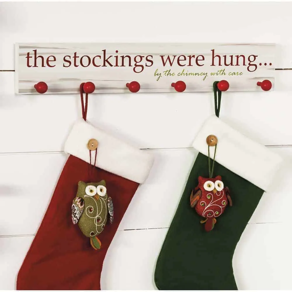 wall mount stocking holder with "The stockings were hung by the chimney with care" written on it