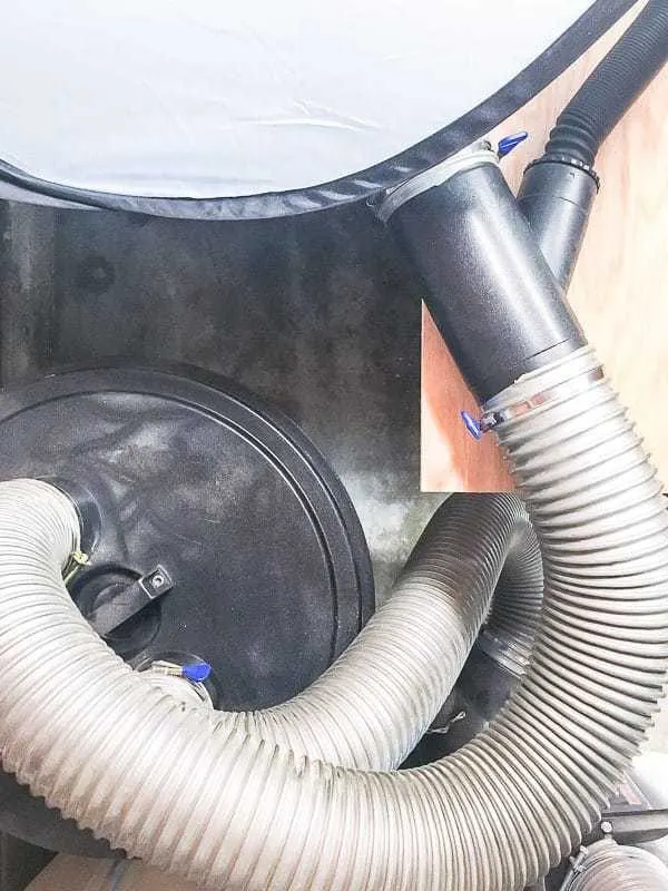 dust collection hoses attached to miter saw dust hood