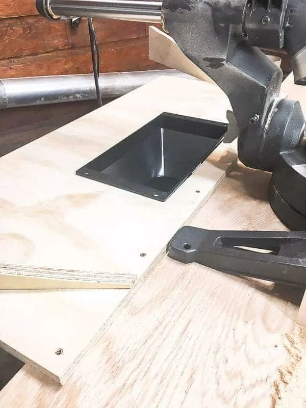 platform for miter saw dust hood attached to the back of the miter saw stand