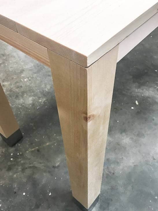 Make sure your planked top matches up perfectly with the edges of your wood and metal desk frame.