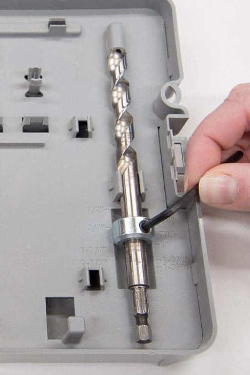 adjusting the depth of the drill bit using the guide markings on the inside of the Kreg Jig R3 case