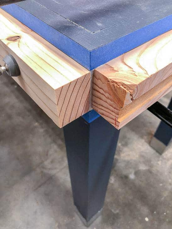 Use clamps to get a crisp corner on the edge of your wood and metal desk.