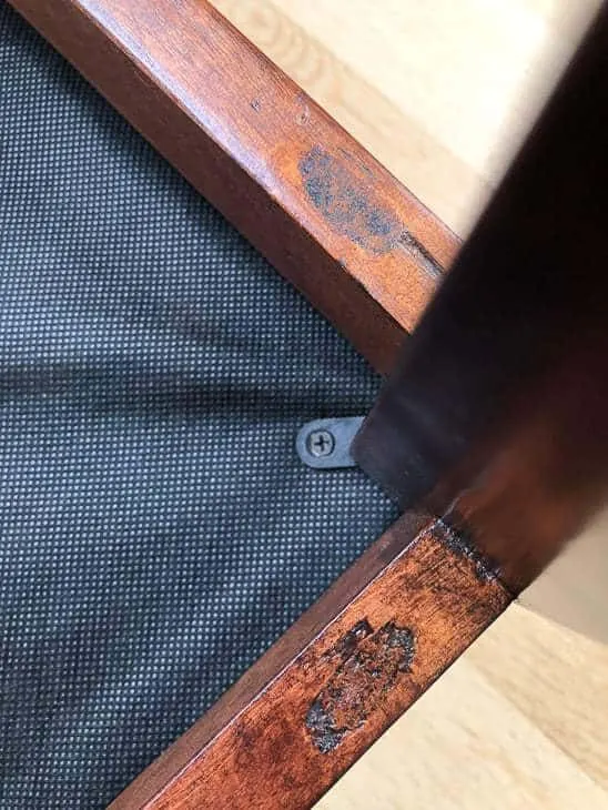 ottoman upside down with screws showing