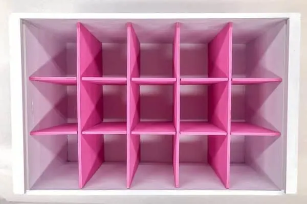 white box with pink box dividers arranged in a grid