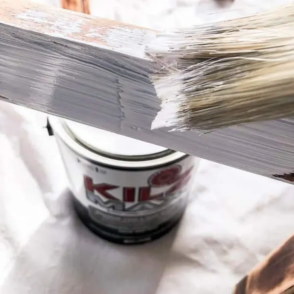 ottoman base being painted white with Kilz Max can in the background