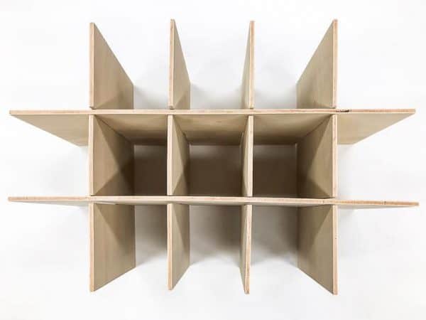 grid of plywood pieces used as box dividers