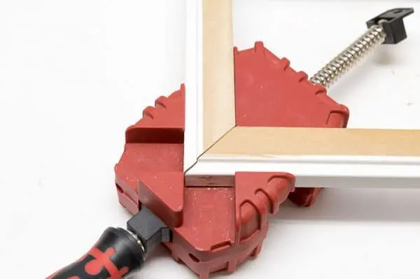 corner clamp holding trim pieces together