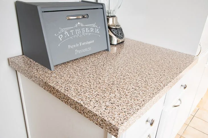 contact paper kitchen counter with bread box and blender on countertop