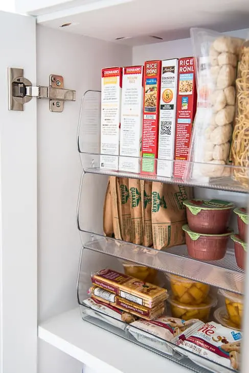 interior of pantry with stackable bins holding food