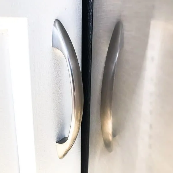 cabinet door handle and refrigerator door with small space in between