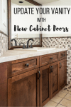 bathroom vanity with dark brown cabinet doors, limestone countertop and stone mosaic backsplash with text overlay reading "Update Your Vanity with New Cabinet Doors"