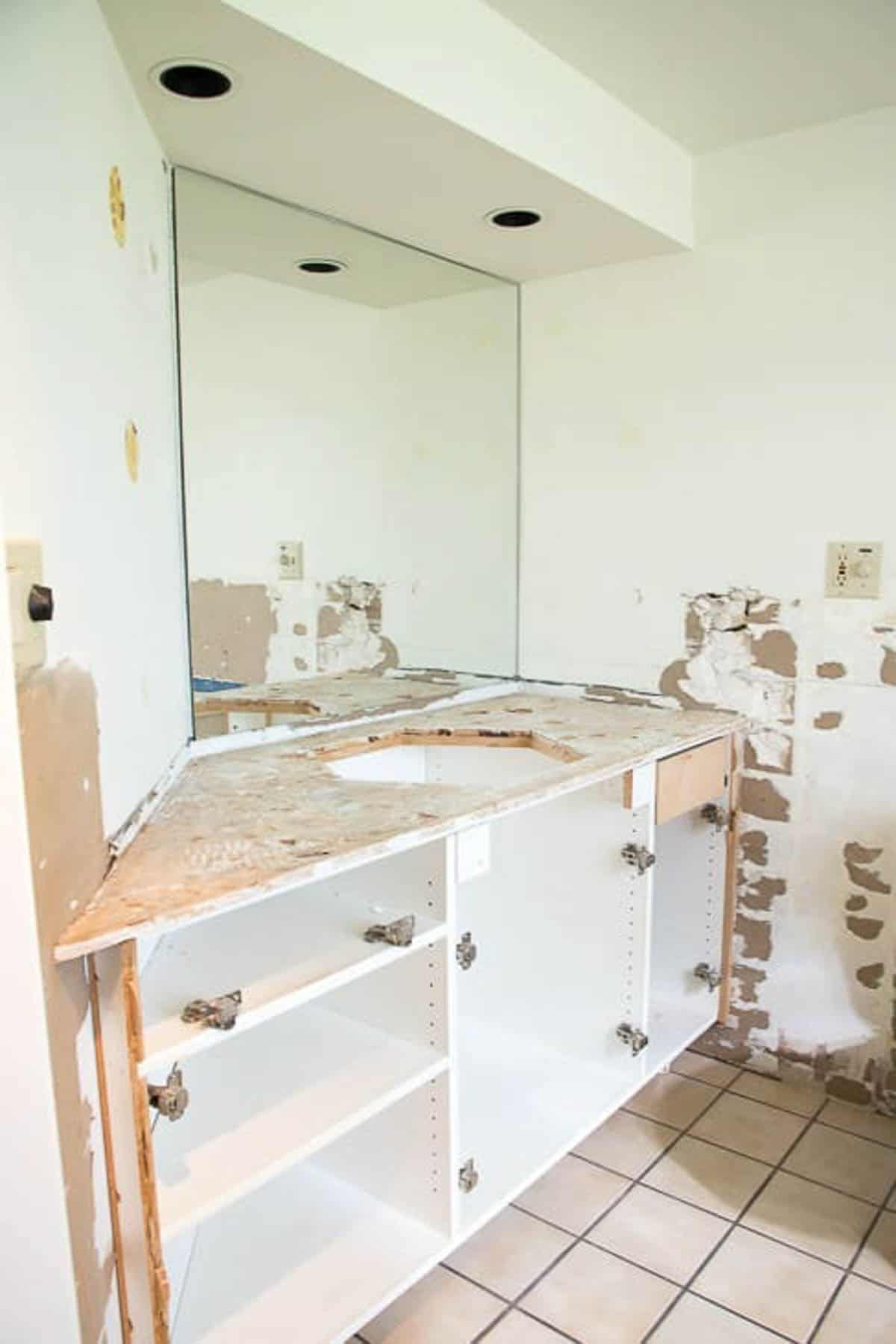 bathroom vanity with tile and doors removed