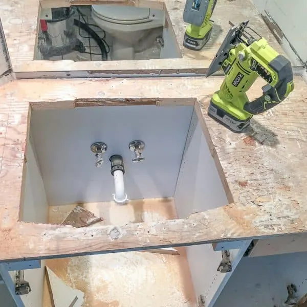 sink hole cut into plywood top of bathroom vanity