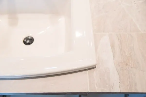 limestone tile with almond sink