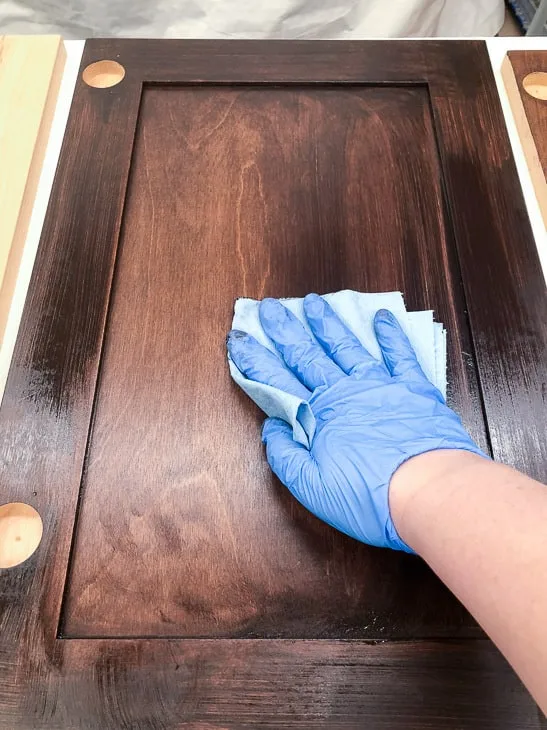 wiping excess General Finishes Java Gel stain off of new cabinet doors