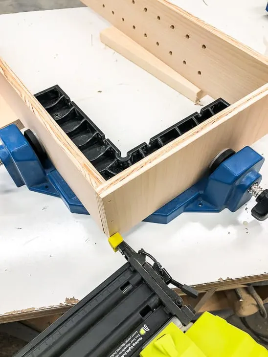 assembling recessed bathroom shelves with a brad nailer and clamps