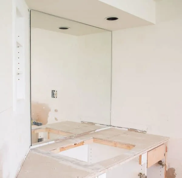 bathroom remodel in progress - recessed bathroom shelves installed and vanity ready for tile