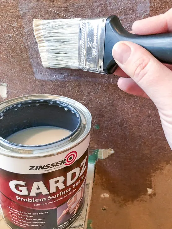 applying Gardz Problem Surface Sealer to torn drywall paper
