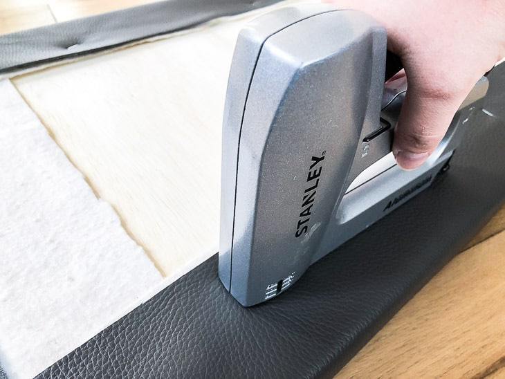 stapling leather to back of DIY shoe bench cushion