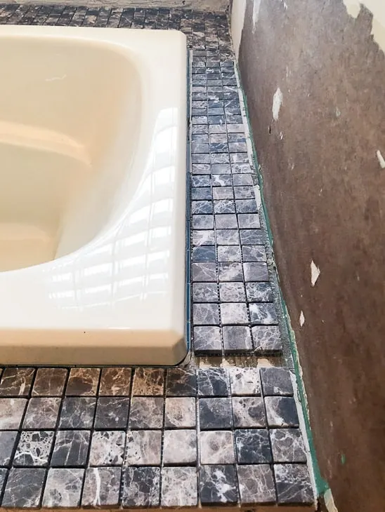 bathtub surround with new tile being dry fit