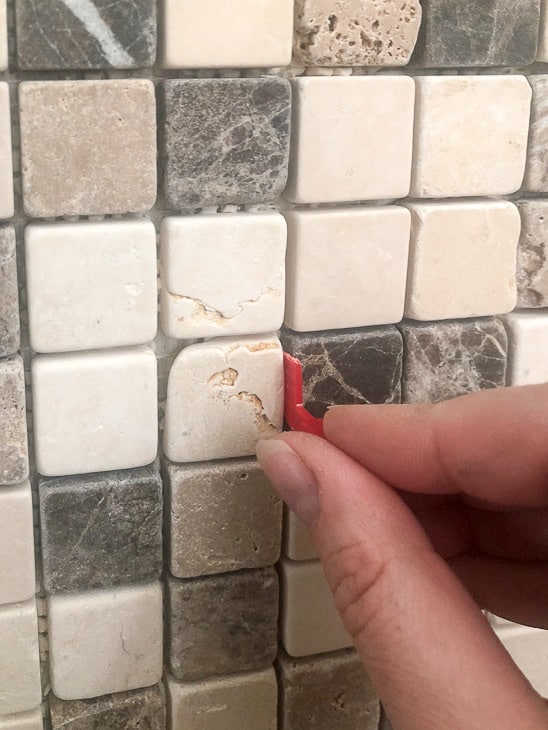 using tile spacer to push thinset back into grout line