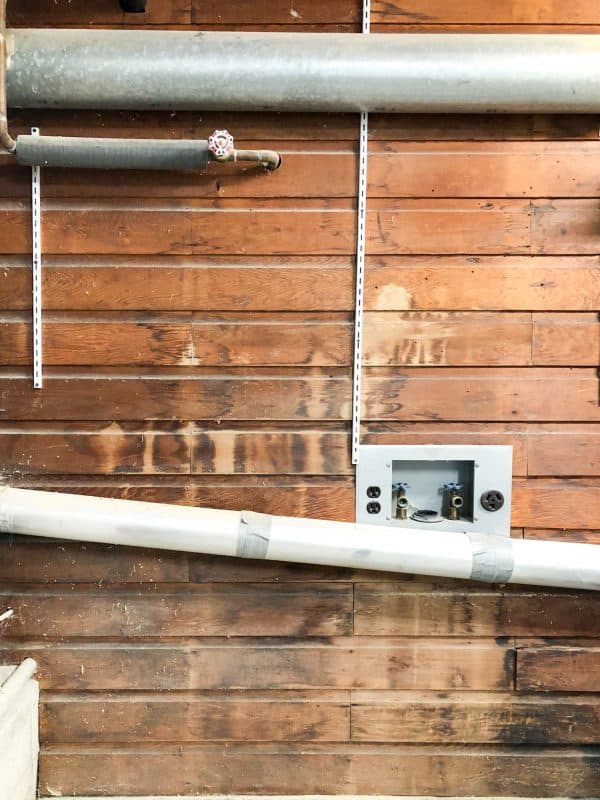 garage wall with tongue and groove cedar plank wall and ductwork