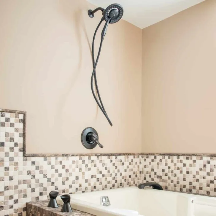 shower installed over jacuzzi bathtub
