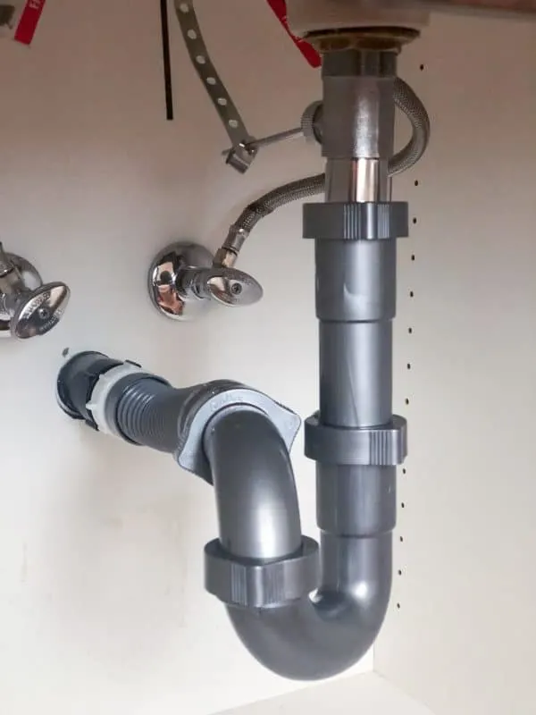 flexible waste pipe under sink with p trap attached