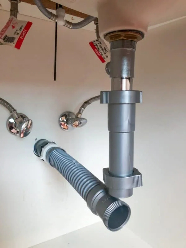 flexible drain pipe with extension piece on sink drain