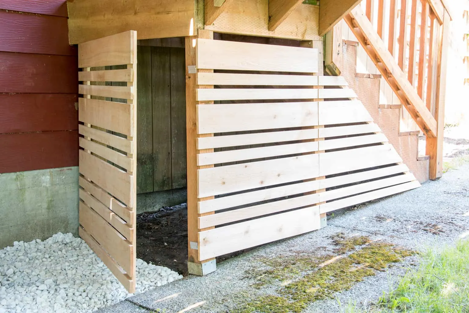 under deck storage area with removable fence panel open