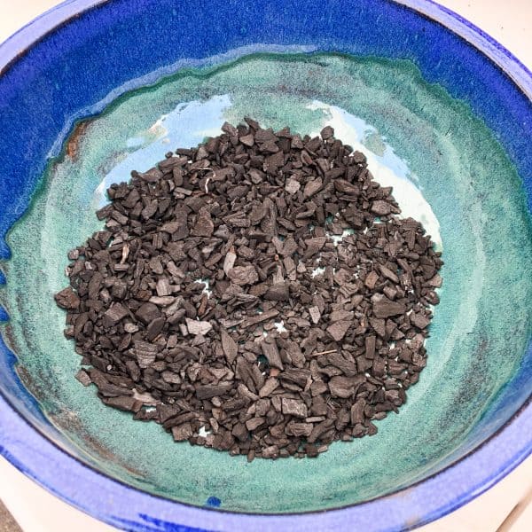 charcoal at the bottom of a carnivorous bog planter garden